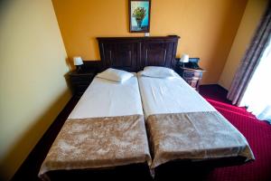 Postel nebo postele na pokoji v ubytování Hotel Clasic
