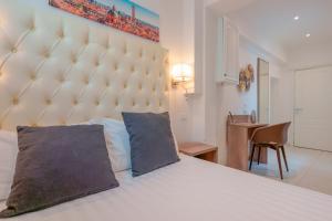 En eller flere senge i et værelse på Attico di Via d'Azeglio