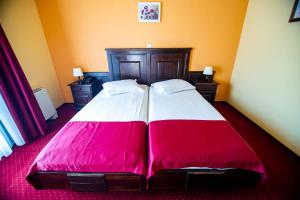Postel nebo postele na pokoji v ubytování Hotel Clasic