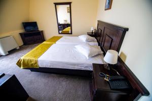 Postel nebo postele na pokoji v ubytování Hotel Clasic