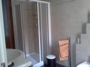 a bathroom with a shower and a toilet at B&B Trento Nord in Trento