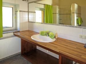 a bathroom with a sink and a mirror at Holiday Home Haus Seitner - BMG160 by Interhome in Mühlbach