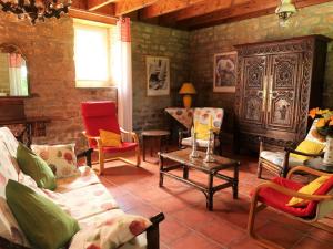 a living room with chairs and a couch and a table at Holiday Home La Ferme Bis by Interhome in Loctudy