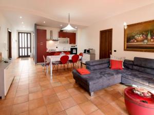 a living room with a couch and a table at Apartment Etna View by Interhome in Mascali