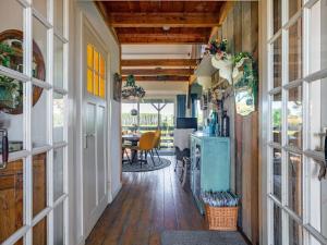 a hallway in a tiny house with a dining room at Holiday Home Polderzicht by Interhome in Zuid-Beijerland