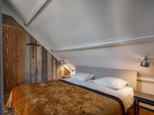 Łóżko lub łóżka w pokoju w obiekcie Holiday Home Polderzicht by Interhome