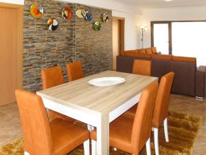 a dining room with a table and chairs at Holiday Home Do Pinheiros by Interhome in Vau