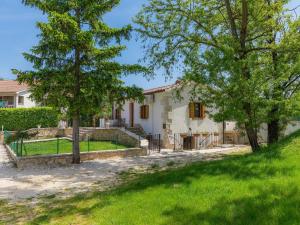 a house with a fence in front of a yard at Holiday Home Susanne by Interhome in Gorica