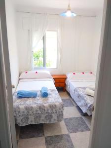 Cama o camas de una habitación en Vacaciones tranquilas Cádiz