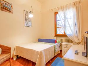 A bed or beds in a room at Holiday Home Villa Rosa by Interhome