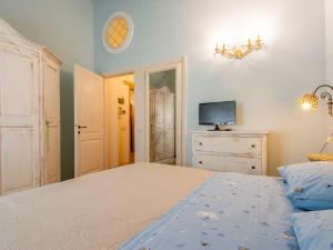 A bed or beds in a room at Holiday Home Villa Rosa by Interhome