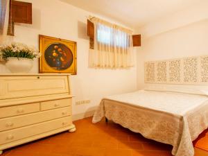 A bed or beds in a room at Holiday Home Villa Rosa by Interhome