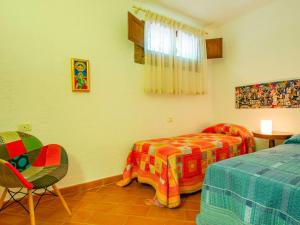 A bed or beds in a room at Holiday Home Villa Rosa by Interhome