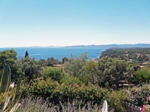 a view of the ocean from a hill with trees at Holiday Home Panorama by Interhome in Drammont