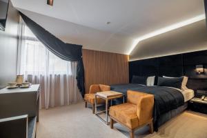 MK Resort (ex. Magiya Karpat) tesisinde bir odada yatak veya yataklar