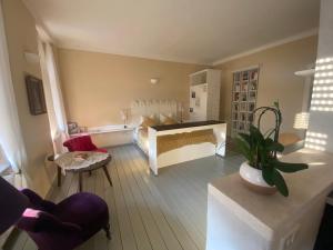 a room with a bedroom with a bed and a table at Altstadthaus Cityappartements in Graz