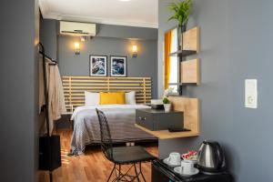 a bedroom with a bed and a desk with a chair at Sayeban Hotel Istanbul in Istanbul