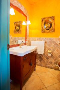 a bathroom with a sink and a mirror at Casale Villa Giulia in Lesina