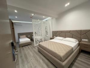 Postel nebo postele na pokoji v ubytování Hotel Mare 2
