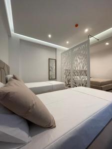 Postel nebo postele na pokoji v ubytování Hotel Mare 2