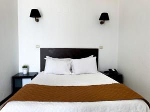 Postel nebo postele na pokoji v ubytování Hotel Cubata