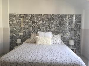 Posteľ alebo postele v izbe v ubytovaní Apartamentos Playa Portonovo