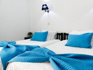 Postel nebo postele na pokoji v ubytování Hotel Cubata