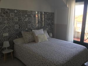 Posteľ alebo postele v izbe v ubytovaní Apartamentos Playa Portonovo