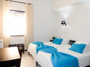 Postel nebo postele na pokoji v ubytování Hotel Cubata