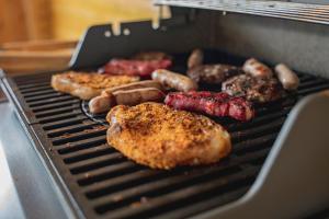 a grill with different types of food on it at Beau Vista Lodge in Dunnamanagh