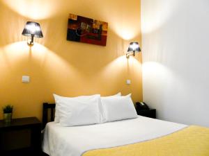 Postel nebo postele na pokoji v ubytování Hotel Cubata