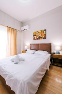 Un pat sau paturi într-o cameră la Hotel Cronos