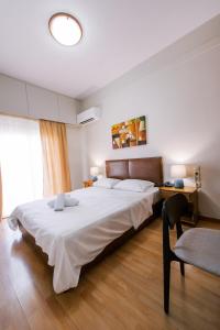 Postel nebo postele na pokoji v ubytování Hotel Cronos + 31 fotografií