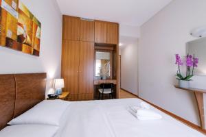 Voodi või voodid majutusasutuse Hotel Cronos toas
