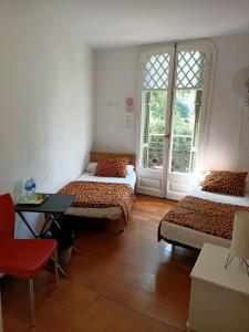 Ένα ή περισσότερα κρεβάτια σε δωμάτιο στο Diagonal House Hostel