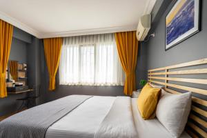 A bed or beds in a room at Sayeban Hotel Istanbul