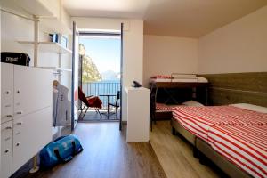 Campione Univela Rooms & Beds - Private Beach房間的床