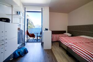 Campione Univela Rooms & Beds - Private Beach房間的床