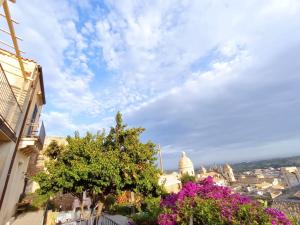 a view from a balcony overlooking a city at Trigona Garden Suite in Noto