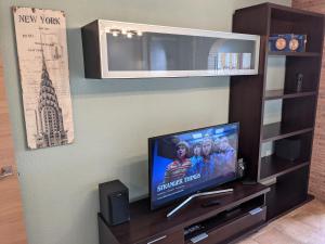 a flat screen tv sitting on a entertainment center at Tortuga Flat in Alicante