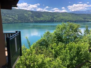 a view of a lake from the balcony of a house at Seeblick in Döbriach