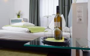 Postel nebo postele na pokoji v ubytování Gartenstadt Hotel