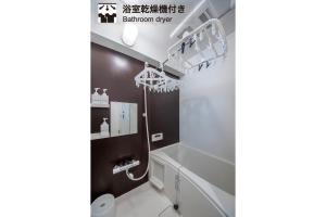 a bathroom with a toilet and a sink at Home Sweet Office Heiwajima in Tokyo