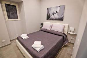 Postel nebo postele na pokoji v ubytování Montesanto Station