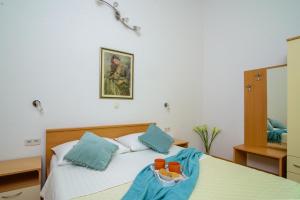 Postel nebo postele na pokoji v ubytování Apartments Kasalo