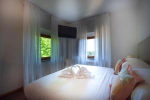 Postel nebo postele na pokoji v ubytování Villa Scacciapensieri Boutique Hotel