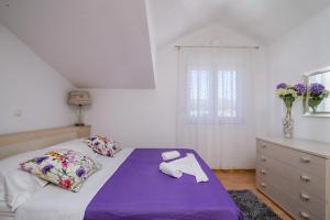 Postel nebo postele na pokoji v ubytování Apartments Kasalo