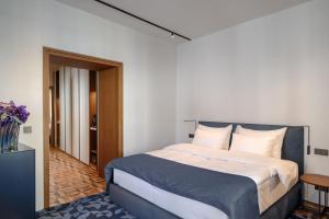 a bedroom with a large bed in a room at Zlata Ladjica Boutique Hotel in Ljubljana