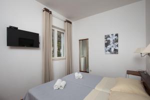 Ένα ή περισσότερα κρεβάτια σε δωμάτιο στο Villa Konalic +19 φωτογραφίες