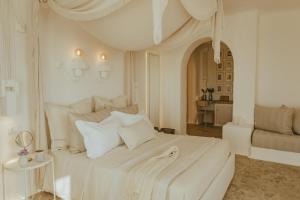 Ένα ή περισσότερα κρεβάτια σε δωμάτιο στο Masseria Borgo Ritella